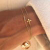 bracelet-croix-en-or-18-carats-illusion-aupiho-joaillerie